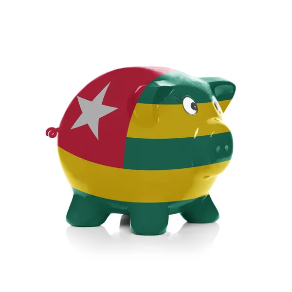 Piggy bank with flag coating over it - Togo — Stock Photo, Image