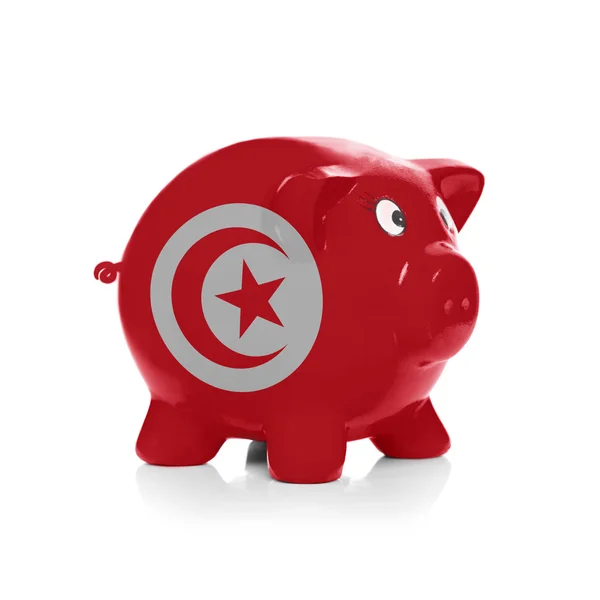 Piggy bank with flag coating over it - Tunisia — Stock Photo, Image