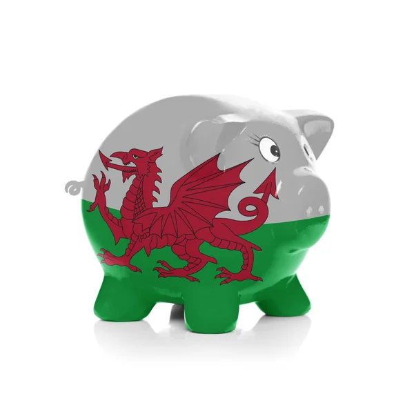 Sparschwein mit Flagge Beschichtung drüber - wales — Stockfoto