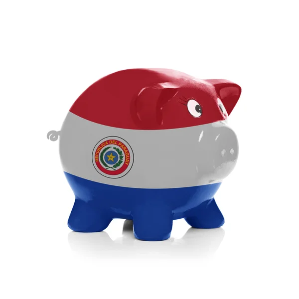 Piggy bank with flag painting over it - Paraguay — Stock Photo, Image