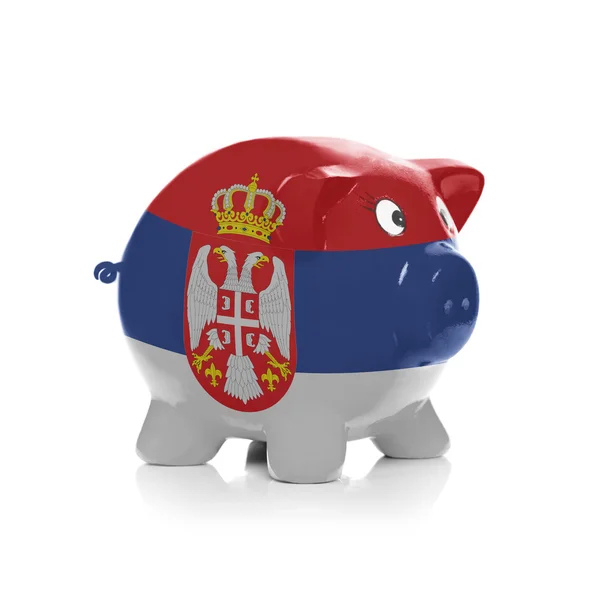 Piggy bank with flag painting over it - Serbia — Stok Foto