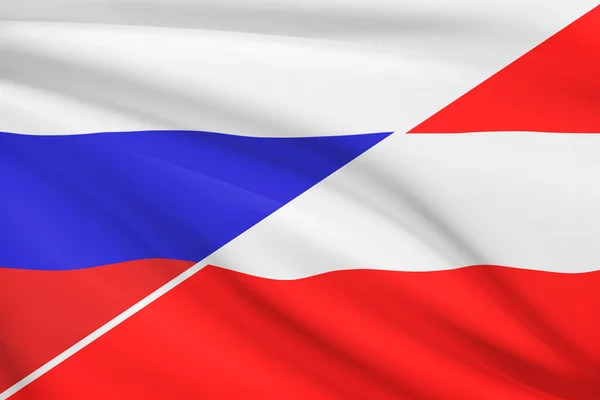 Serie von gekräuselte Flags. Russland und Österreich. — Stockfoto