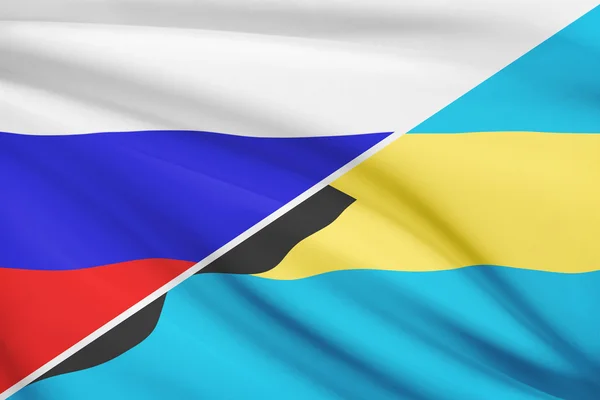 Series of ruffled flags. Russia and Barbados. — Stock Photo, Image