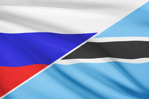 Series of ruffled flags. Russia and Botswana. — Stock Photo, Image