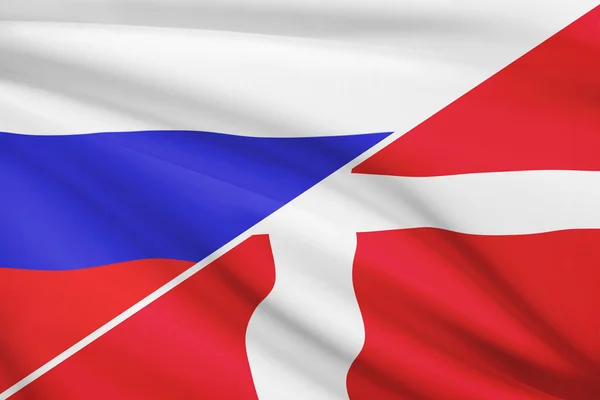 Series of ruffled flags. Russia and Kingdom of Denmark. — Stock Photo, Image