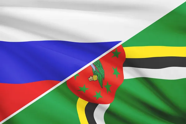 Series of ruffled flags. Russia and Commonwealth of Dominica. — Stock Photo, Image