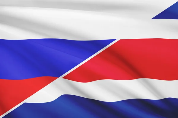 Serie von gekräuselte Flags. Russland und der Republik Costa rica. — Stockfoto