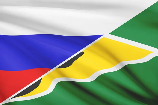 Serie von gekräuselte Flags. Russland und kooperative Republik guyana. — Stockfoto