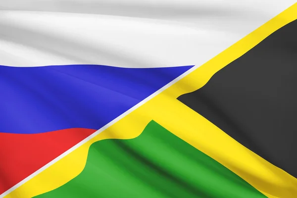 Series of ruffled flags. Russia and Commonwealth of Jamaica. — Stock Photo, Image