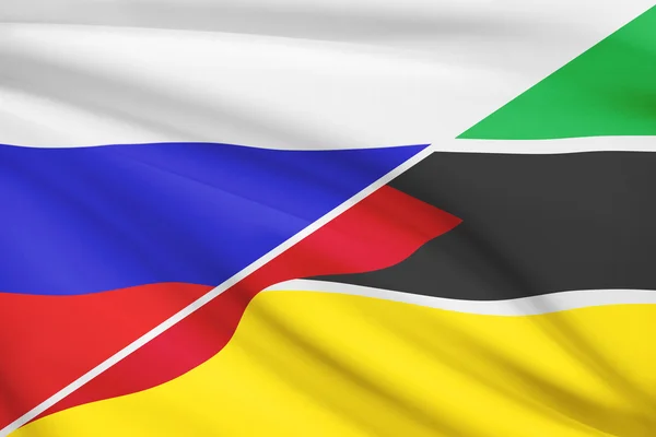 Series of ruffled flags. Russia and Republic of Mozambique. — Stock Photo, Image