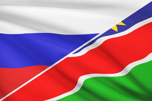 Series of ruffled flags. Russia and Republic of Namibia. — Stock Photo, Image