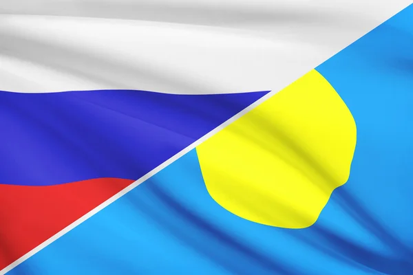 Serie von gekräuselte Flags. Russland und der Republik von palau. — Stockfoto