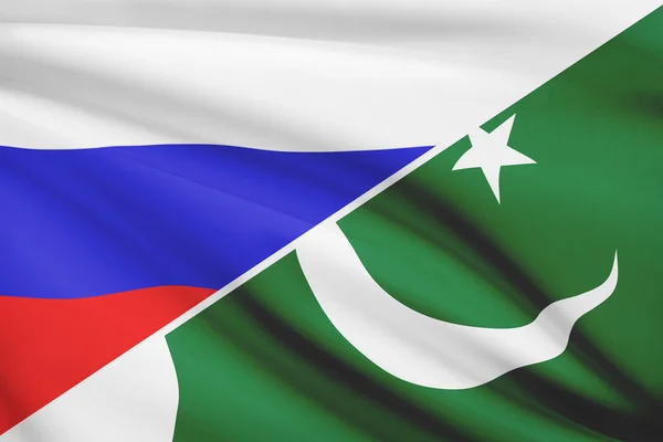 Series of ruffled flags. Russia and Islamic Republic of Pakistan. — Stock Photo, Image