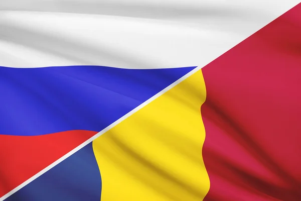 Series of ruffled flags. Russia and Romania. — Stock Photo, Image