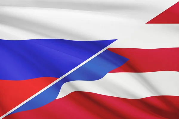 Series of ruffled flags. Russia and Commonwealth of Puerto Rico. — Stock Photo, Image