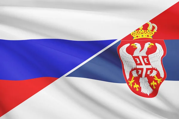 Series of ruffled flags. Russia and Republic of Serbia. — Stock Photo, Image