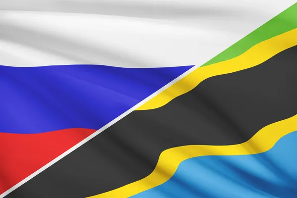 Series of ruffled flags. Russia and United Republic of Tanzania. — Stock Photo, Image