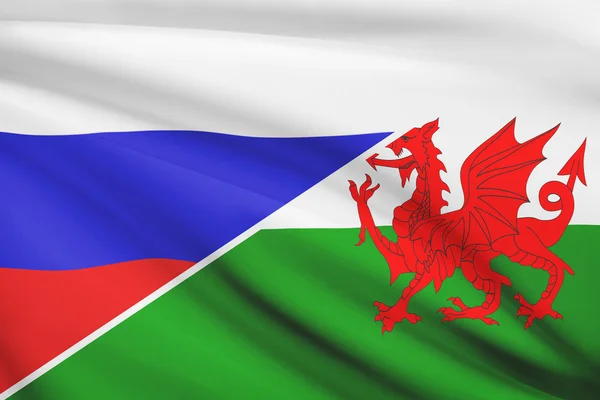 Series of ruffled flags. Russia and Wales - Cymru. — Stock Photo, Image