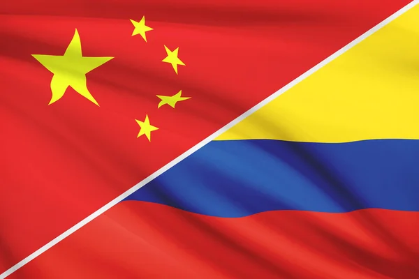 Series of ruffled flags. China and Republic of Colombia. — Stock Photo, Image
