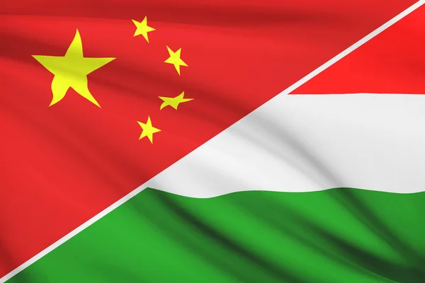 Series of ruffled flags. China and Hungary. — Stock Photo, Image