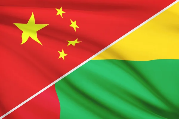 Serie di bandiere arruffati. Cina e Repubblica di Guinea-Bissau. — Foto Stock