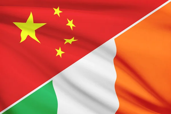 Series of ruffled flags. China and Ireland. — Stock Photo, Image