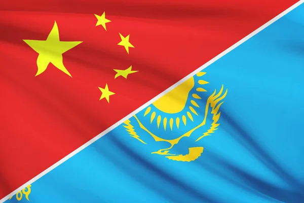 Series of ruffled flags. China and Republic of Kazakhstan. — Stock Photo, Image