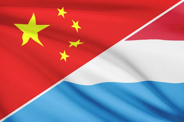 Series of ruffled flags. China and Grand Duchy of Luxembourg. — Stock Photo, Image