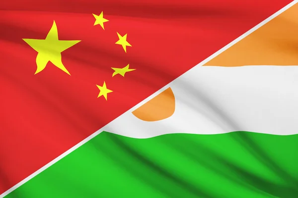 Series of ruffled flags. China and Republic of Niger. — Stock Photo, Image