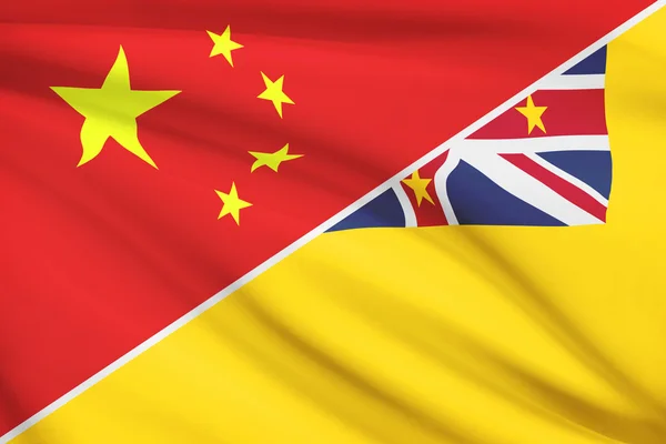 Series of ruffled flags. China and Niue. — Stock Photo, Image