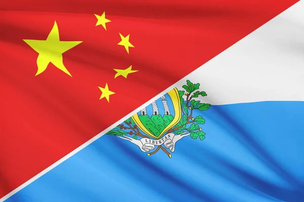 O serie de steaguri zdrobite. China și Republica San Marino . — Fotografie, imagine de stoc