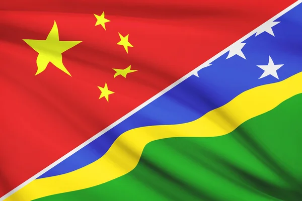 Serie di bandiere arruffati. Cina e Isole Salomone. — Foto Stock