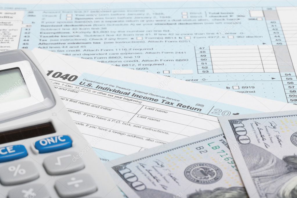 United States of America Tax Form 1040 with calculator and US dollars