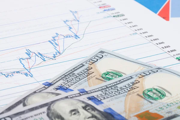 Stock market graph with 100 dollars banknote - studio shot — Stock Photo, Image
