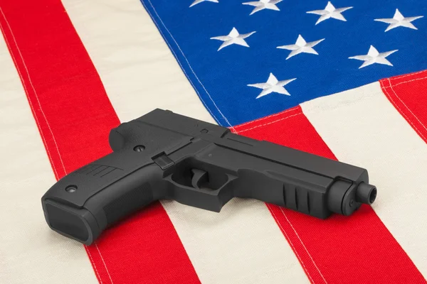 Handgun laying on USA flag - studio shoot — Stock Photo, Image