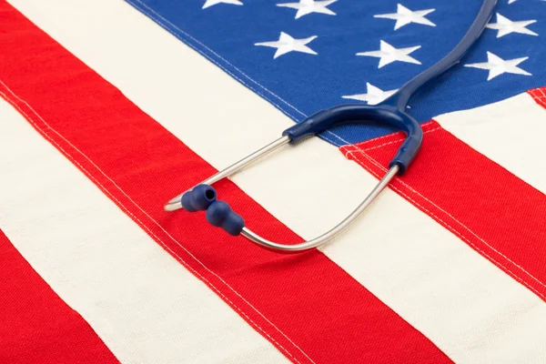 Blue stethoscope over USA flag - studio shoot — Stock Photo, Image