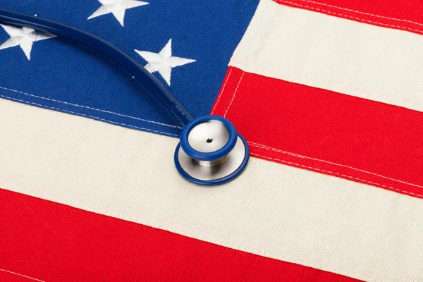 USA flag with stethoscope over it - studio shoot — Stock Photo, Image