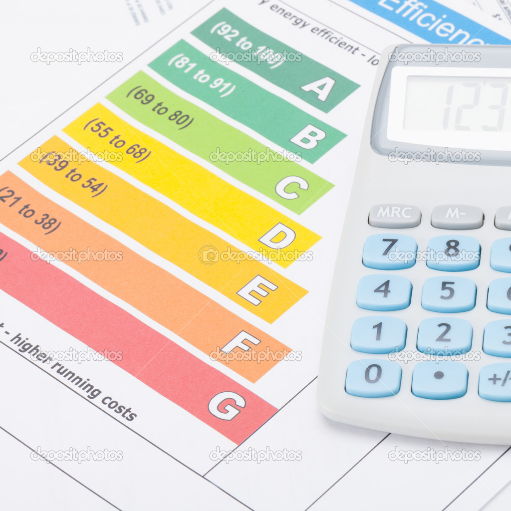 Calculator over energy efficiency chart - studio shot - 1 to 1 ratio
