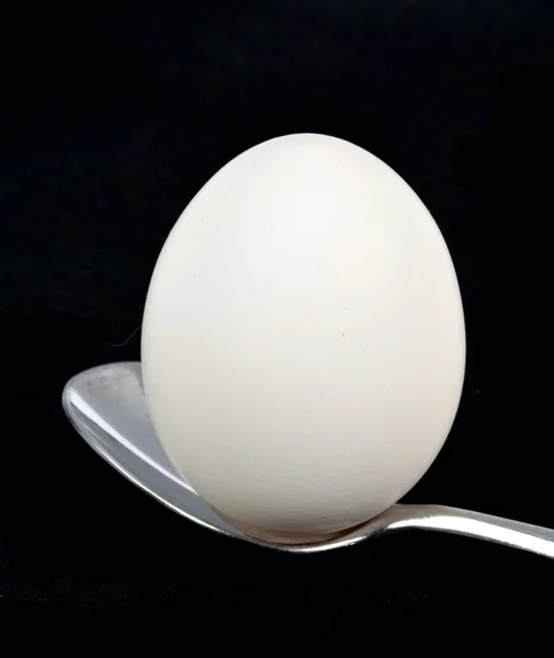Egg on a spoon — Stock Photo, Image