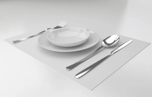 A place setting with silver fork, knife spoon and white plat — Stock Photo, Image