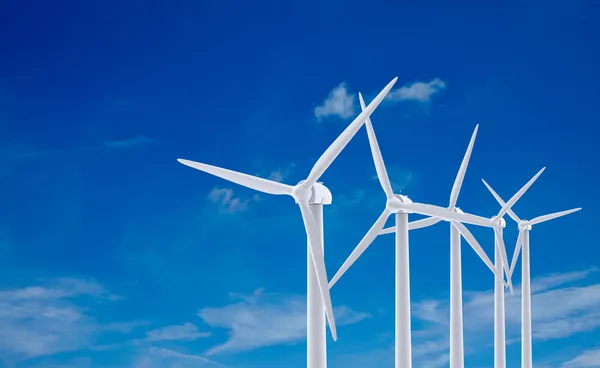 White wind turbine generating electricity on blue sky — Stock Photo, Image