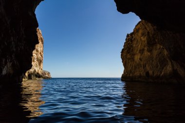 Sea cave on the mediterranean sea clipart