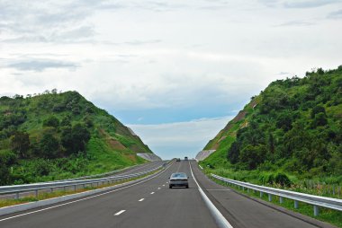 Highway Cut Into Hills clipart