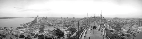Panoramic photo in Black and White of the view of Guayaquil from the top of the lighthouse on the Cerro Santa Ana (Saint Ana hill), a moment before sunset after a warm sunny summer day. Ecuador.