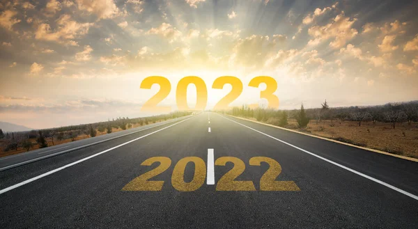 Start plan for 2023. The year 2023 was written on the asphalt road at sunrise. Concept of business strategy, opportunity ,hope and new life change.