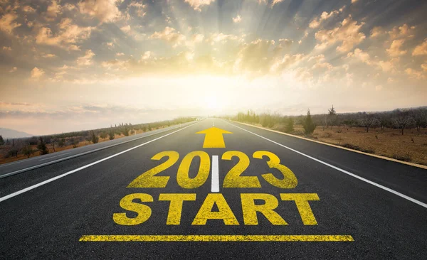 Start Plan 2023 Year 2023 Written Asphalt Road Sunrise Concept lizenzfreie Stockfotos