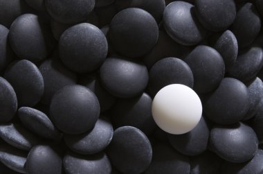 White on black go stones clipart