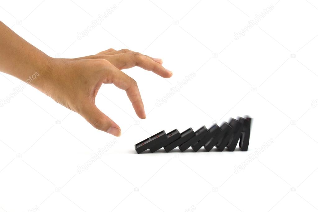 hand and dominoes