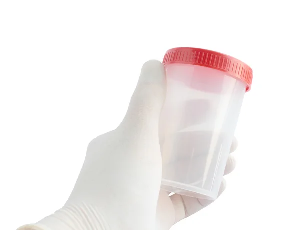 Hand in a glove holding a clear jar for tests — Stock Photo, Image