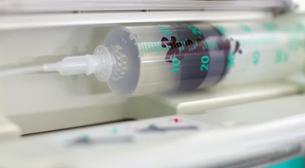 Syringe in the syringe pump — Stock Photo, Image